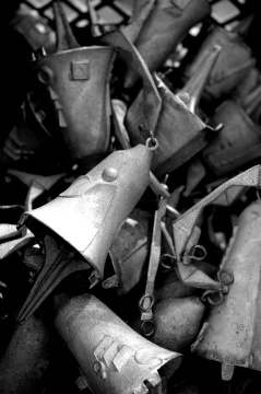 Black and white photograph of unfinished bell castings at Arcosanti